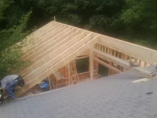 Framing a new roof addition that ties into an existing shingle roof in Friendswood